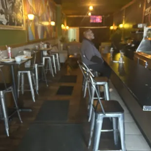 Bar has like 5 seats then there's 4 tables and two per tables