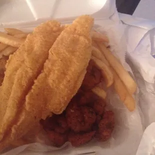 Kinda cooked catfish (not done in center but looks pretty)and shrimp combo.