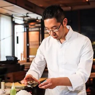 Chef Gene-San creating the Momotaro oyster.