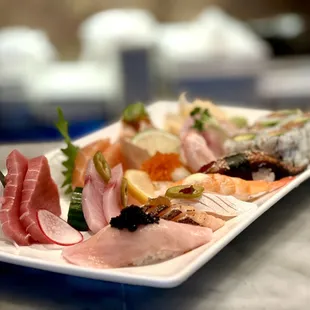 a platter of sushi on a table
