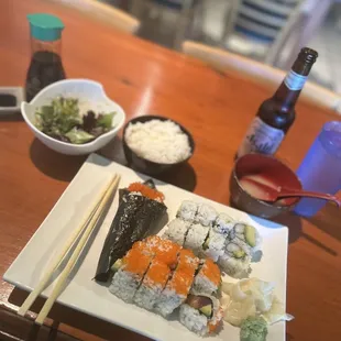 Sushi combo with a side of rice and "small" Asahi.