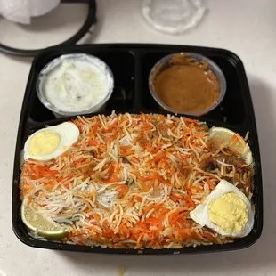 a meal in a black tray