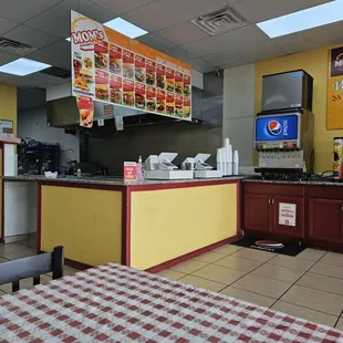 Loud overhead grill vent and very loud ice machine above the soda machine.