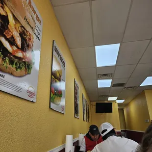 Worn corners on the pictures and a switched off TV.