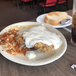 Chicken fried steak, eggs, hash browns and toast. Enough for 2 people!