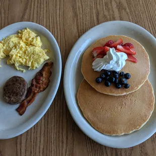 two plates of breakfast food