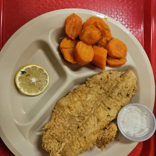 One fried catfish and some boiled carrots for $13.50, literally. Doesn&apos;t come with bread or anything extra. $13.50 as is.