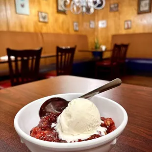 Strawberry Cobbler topped with Vanilla Ice cream.