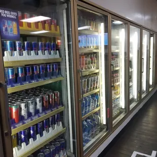 a row of coolers filled with drinks
