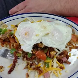 Meatlover's skillet with over medium eggs