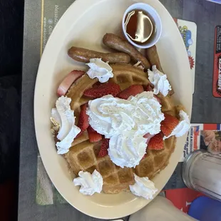 Waffle with strawberries and whipped cream