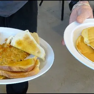 "Dana's Delight," a bacon, avocado, tomato, onion and American cheese omelette, along with a short stack of pancakes.