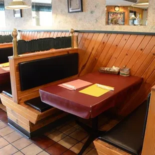 a table and booths in a restaurant