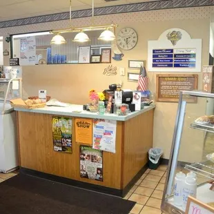 a kitchen with a counter and refrigerator
