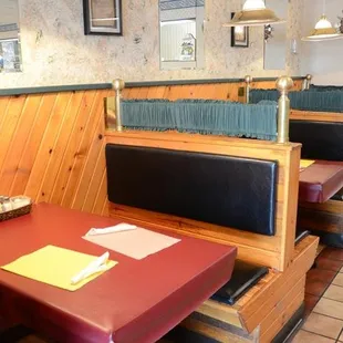 a table and booths in a restaurant