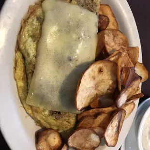 Sausage mushroom and white cheddar omelette with fried potatoes
