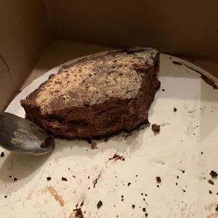 a half eaten chocolate cake