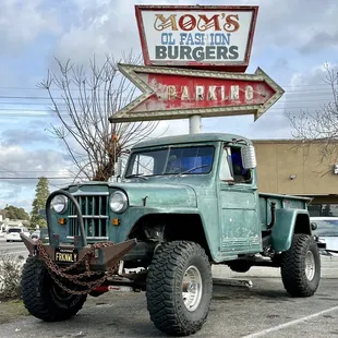  green truck parked in a parking lot