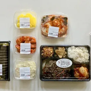 Banchan for days!  And the tastiest kimbap.   Also, they have cooked to order take away boxes that have banchan included!