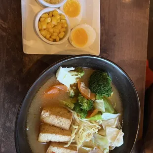 Veggie ramen Spicy with Corn, Garlic and soft boiled Egg on the side