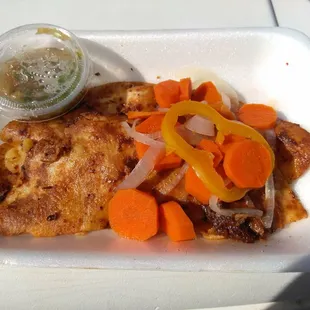 a meal in a styrofoam container