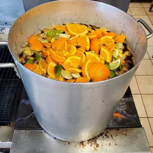 a pot full of oranges