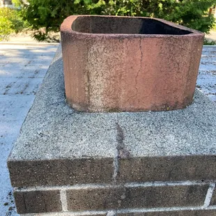 a brick planter on top of a brick wall