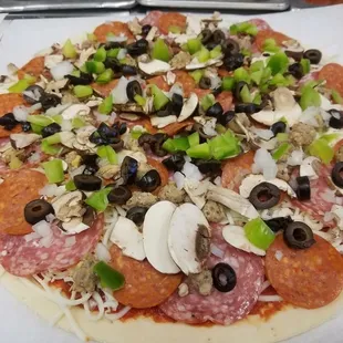 pepperoni, olives, and mushrooms