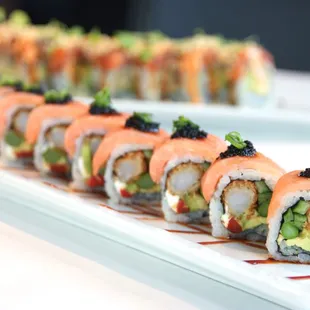 West Philly Roll- coconut shrimp, asparagus, roasted red pepper, cream cheese, avocado, topped with smoked salmon, scallion, black tobiko.