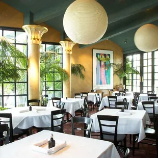a dining room with tables and chairs