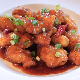 Spicy Orange Chicken- crispy chicken, thai chili peppers, sweet and spicy chili sauce.
