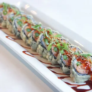 Kim Jong Roll-shrimp tempura, kimchi, cucumber, asparagus, deep fried with korean bbq sauce.