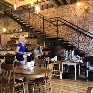 a woman standing in a restaurant