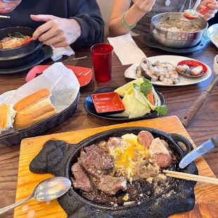 a man eating a meal with chopsticks
