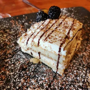 Tiramisu. It's hard to see, but there are these little dark chocolate bits around the plate that add to each perfect bite.