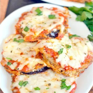 a plate of eggplant pizzas