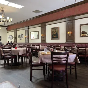 a dining room with tables and chairs