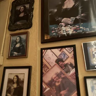 a wall full of framed photos