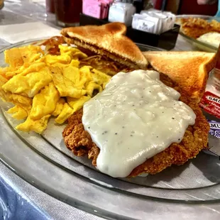 Chicken Fried Steak with White Gravy, Scrambled Eggs, Hashbrowns and Toast. Crunchy and fresh made. Very good! Give it a try!