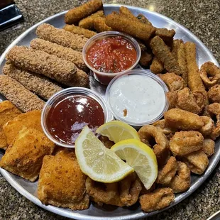 a platter of fried fish and fries