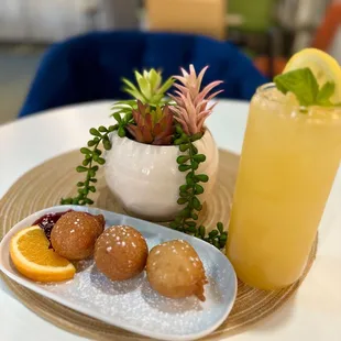 a plate of donuts and a drink