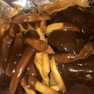 Open faced roast beef platter and fries with gravy all over