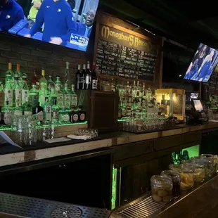 a bar with many bottles of liquor