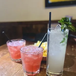 three cocktails on a table