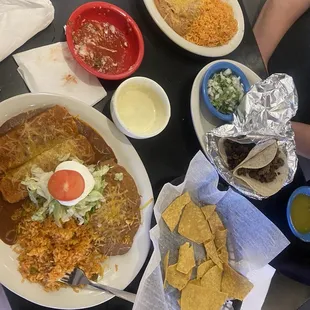 Steak tacos (delicious!!), enchiladas Rojas, queso dip, salsa and beans and rice.