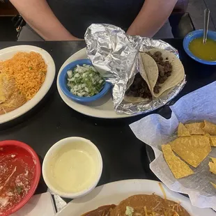 Steak tacos (delicious!!), enchiladas Rojas, queso dip, salsa and beans and rice.