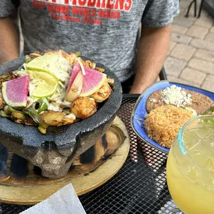 Molcajete with rice, beans and corn tortillas