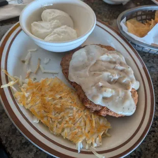 Country fried steak with poached eggs