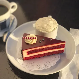 Red Velvet Cake (gluten free) a red hued flourless cake, filled with smooth cheesecake moose and dark chocolate crumbs