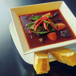 Braised Beef Stew (Bo Kho); slow cooked boneless beef chuck in a stew of carrots, onions, cloves and lemongrass.
